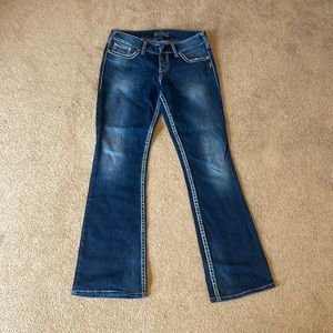 Silver suki mid rise flare jeans.